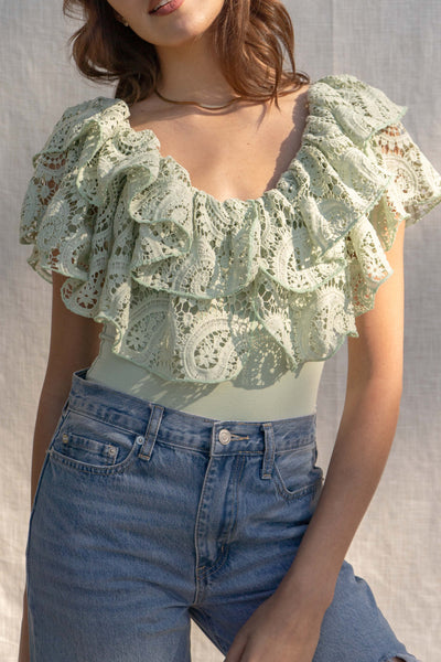 With a fitted silhouette, this versatile bodysuit features crochet and ruffle detailing, crafted for a unique style. sage color.