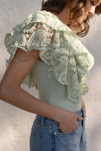 With a fitted silhouette, this versatile bodysuit features crochet and ruffle detailing, crafted for a unique style. sage color.