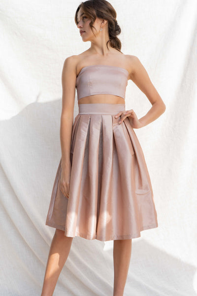 This two-piece set offers an event-ready look with a tube top and midi skirt. sand color.