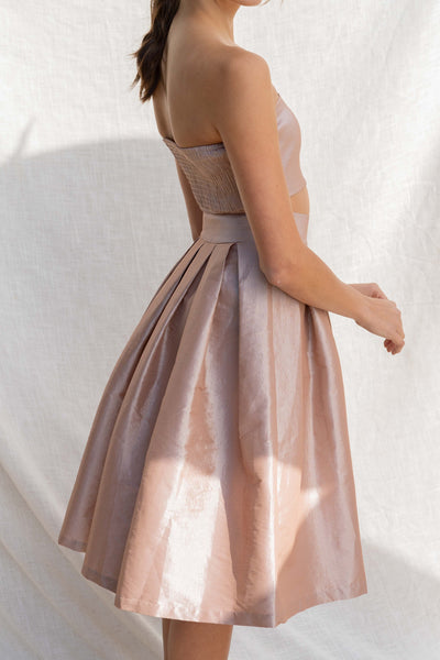 This two-piece set offers an event-ready look with a tube top and midi skirt. sand color.