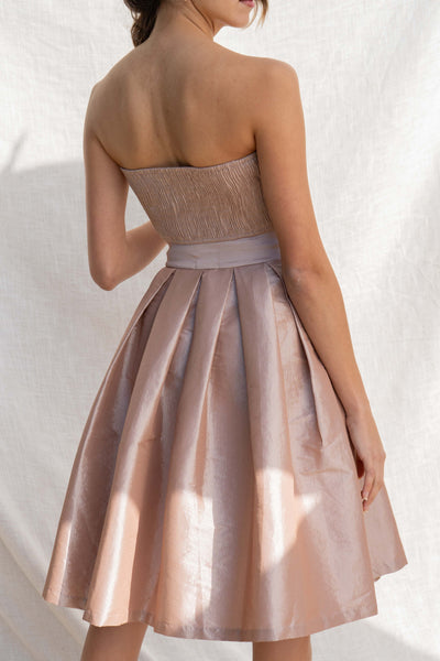 This two-piece set offers an event-ready look with a tube top and midi skirt. sand color.