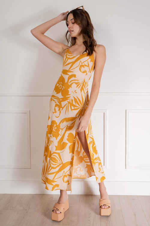 Perfect for any tropical vacation, this relaxed-fit dress features thin straps and a bright and bold tropical print, making it a must-have for any summer getaway. yellow color.
