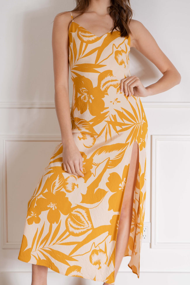 Perfect for any tropical vacation, this relaxed-fit dress features thin straps and a bright and bold tropical print, making it a must-have for any summer getaway. yellow color.