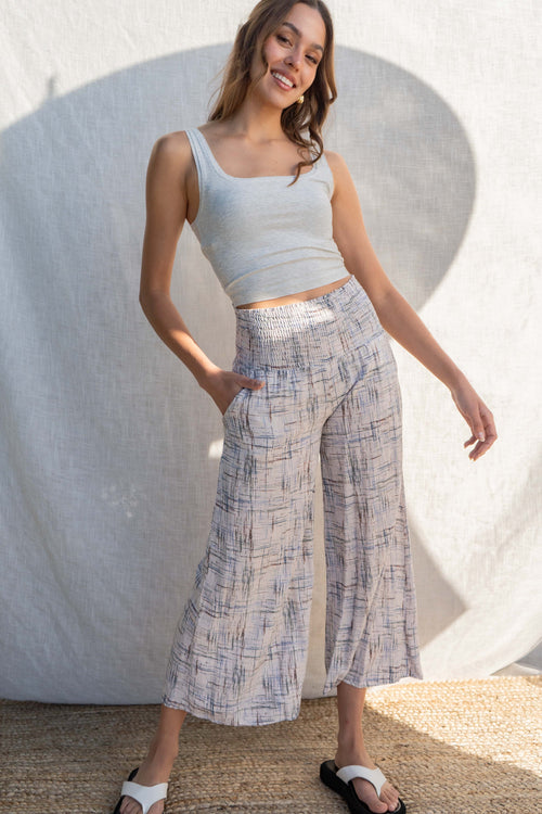 The smocking waist band provides a comfortable and effortless fit, while the relaxed palazzo bottoms add a touch of elegance.