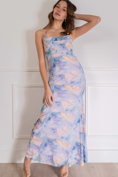 This maxi dress is perfect for any event with its cowl neckline, thin straps, and open back. The unique marble print and soft pastel colors
