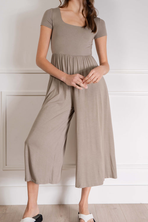 Its fitted design and soft material provide comfort while the flare cropped bottom adds a touch of style. With short sleeves. dark taupe.