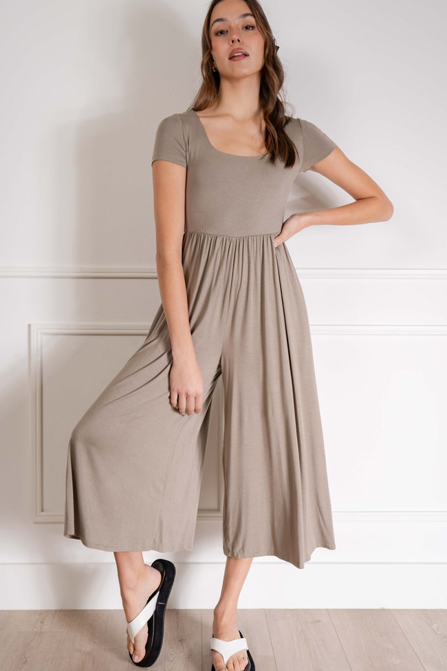 Its fitted design and soft material provide comfort while the flare cropped bottom adds a touch of style. With short sleeves. dark taupe.