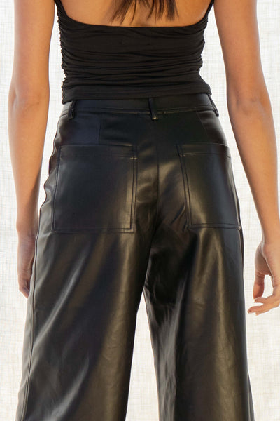Made with faux leather, they offer a stylish yet comfortable fit. Featuring a front zipper with button closure, high-rise design, and wide-leg cut,