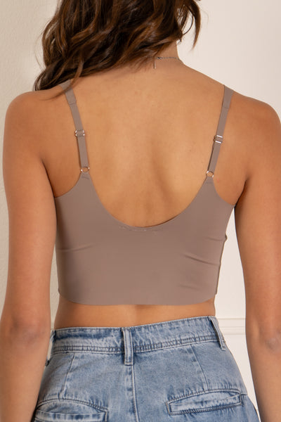 Stacy bonding crop top. adjustable straps and seamless design. V neckline and cropped length. comes in ash, black, and bone colored.