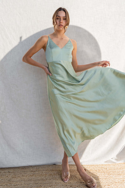 With thin straps and a fitted bust, this dress offers a relaxed fit for all-day comfort. sage color.