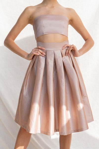This two-piece set offers an event-ready look with a tube top and midi skirt. sand color.