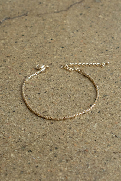 Crafted from thin and lightweight gold colored metal, it's easy to layer for a fashionable finish.