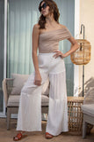 These wide leg bottoms feature a comfy elastic waistband and stylish tiered details. white color. slip underneath.