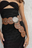 Featuring a unique circular shape and vibrant turquoise stone detail, this belt will add a touch of fun to any outfit.