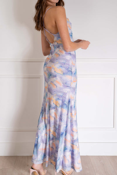 This maxi dress is perfect for any event with its cowl neckline, thin straps, and open back. The unique marble print and soft pastel colors