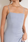 With a fitted silhouette and thin adjustable straps, this dress flatters the figure and allows for easy customization. The open back detail adds a touch of elegance. dusty blue.