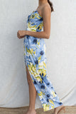 This elegant maxi dress features a high slit and stunning tropical print, making it perfect for any event, from a destination wedding to a night out.