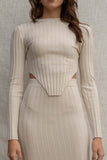 This ribbed two piece set includes a cropped long sleeve top and matching midi skirt, both stretchy and comfortable for a tight fit. oatmeal color.