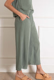 feature a comfortable elastic waistband and front pockets. sage color.