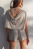 With short sleeves and an elastic waistband, this romper is perfect for any vacation or day in the sun. The open back and linen details add a touch of fun to this must-have piece. taupe color.