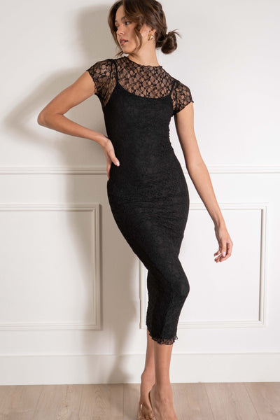 This stunning dress features delicate lace detailing and a flattering tight fit. black color.