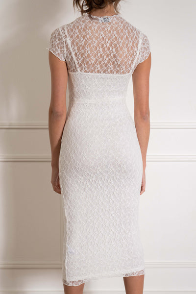 This stunning dress features delicate lace detailing and a flattering tight fit. white color.