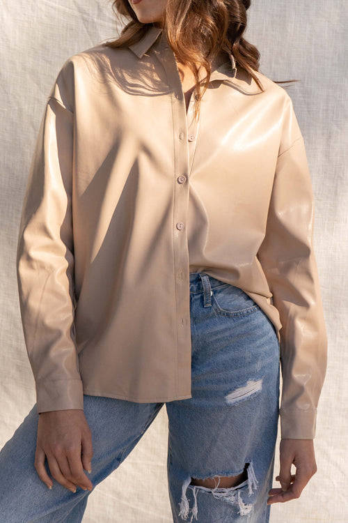 Nicole's Pleather Button Down is light weight and winter ready, perfect for outerwear. It features pleather detail and comes in two colors for a stylish and practical look.