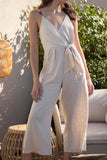 This playful jumpsuit features adjustable straps and a tie waist detail for a comfortable and relaxed fit. The cropped bottoms add a touch of fun to complete the vacay look.