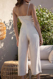 This playful jumpsuit features adjustable straps and a tie waist detail for a comfortable and relaxed fit. The cropped bottoms add a touch of fun to complete the vacay look.