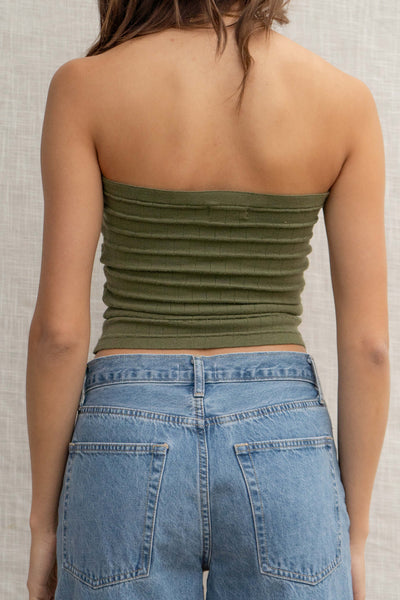 This strapless top features a relaxed fit and a playful knot detail, making it easy to style for any casual day. olive color.
