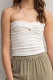 This strapless top features a relaxed fit and a playful knot detail, making it easy to style for any casual day. white color.