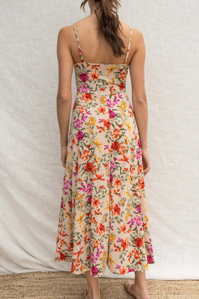 This playful dress features thin straps, a square neckline, and a bold floral print. The fitted bodice flatters your figure while the midi length makes it perfect for day wear.