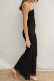 This stunning dress features a strapless design with a plunge neckline, creating a sexy yet elegant look. The mermaid flare and tight fit accentuate your curves. black colored.