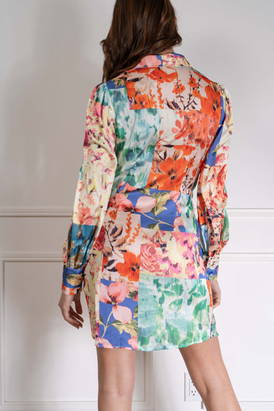 The wrap tie detail accentuates your waist, while the floral print adds a feminine touch. Made with a silky satin-like fabric, this dress offers a relaxed fit for all-day wear.