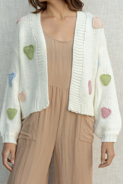 With a relaxed fit and long sleeves, this cardigan is perfect for day wear. Featuring adorable heart details.
