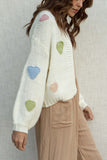 With a relaxed fit and long sleeves, this cardigan is perfect for day wear. Featuring adorable heart details.