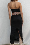 This elegant black maxi dress features a tube top, fitted silhouette, and key hole and lace details