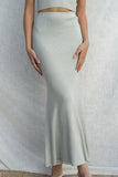 This two piece set includes a knitted tube top and matching mermaid maxi skirt, both stretchy and fitted. sage color.