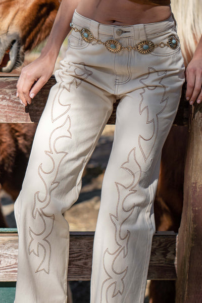 These bottoms feature everything you love in denim bottoms with a flame design in the front.