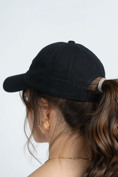 This perfect dad hat features a simple and easy fit, adjustable strap in the back, and comes in two colors, black and white.