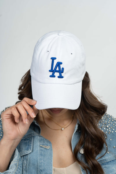 This perfect dad hat features a simple and easy fit, adjustable strap in the back, and comes in two colors, black and white.