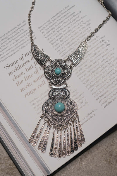 Turquoise fringe detail festival-piece necklace.